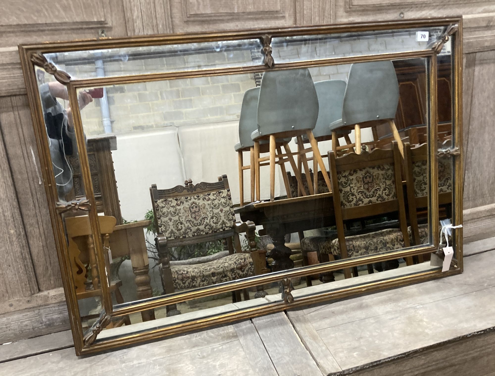 A Georgian style gilt-framed rectangular wall mirror with marginal plates, width 105cm, height 70cm